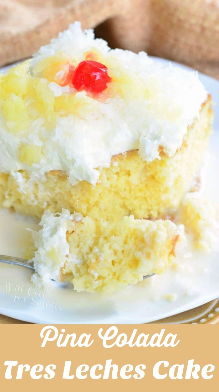 a slice of Tres Leches Cake with white coconut frosting, pineapple and a cherry on top with a fork with some cake on it 