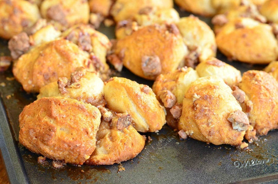 Butter Pecan Pull-Apart Biscuit Muffins with candied pecans on a baking sheet 