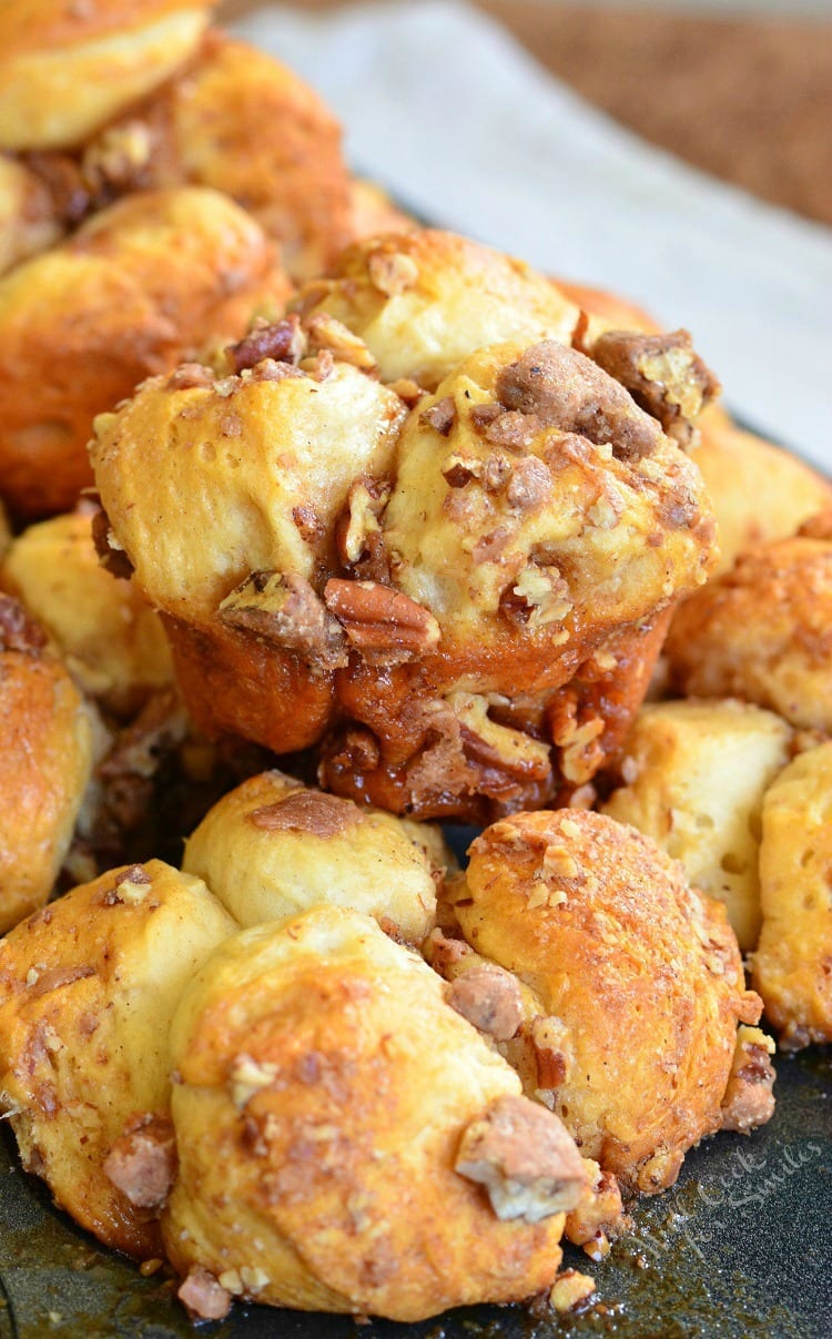 close up photo of pull apart muffins stacked up on a cookie sheet.