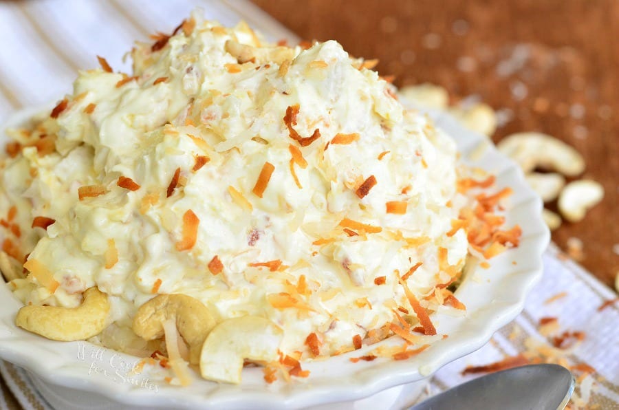 Toasted Coconut Cashew Fluff Salad in a white bowl 