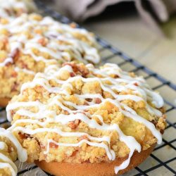 bacon crumb doughnuts on a wire rack