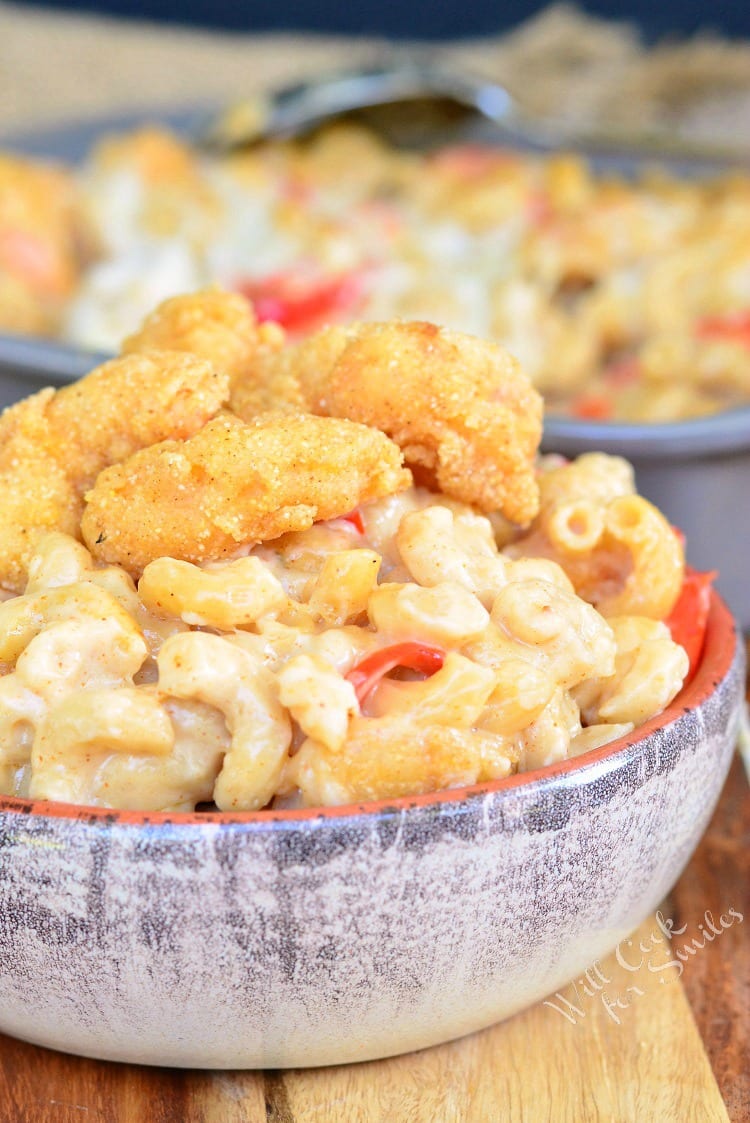 Po'Boy Mac and Cheese with fried shrimp on top in a bowl 