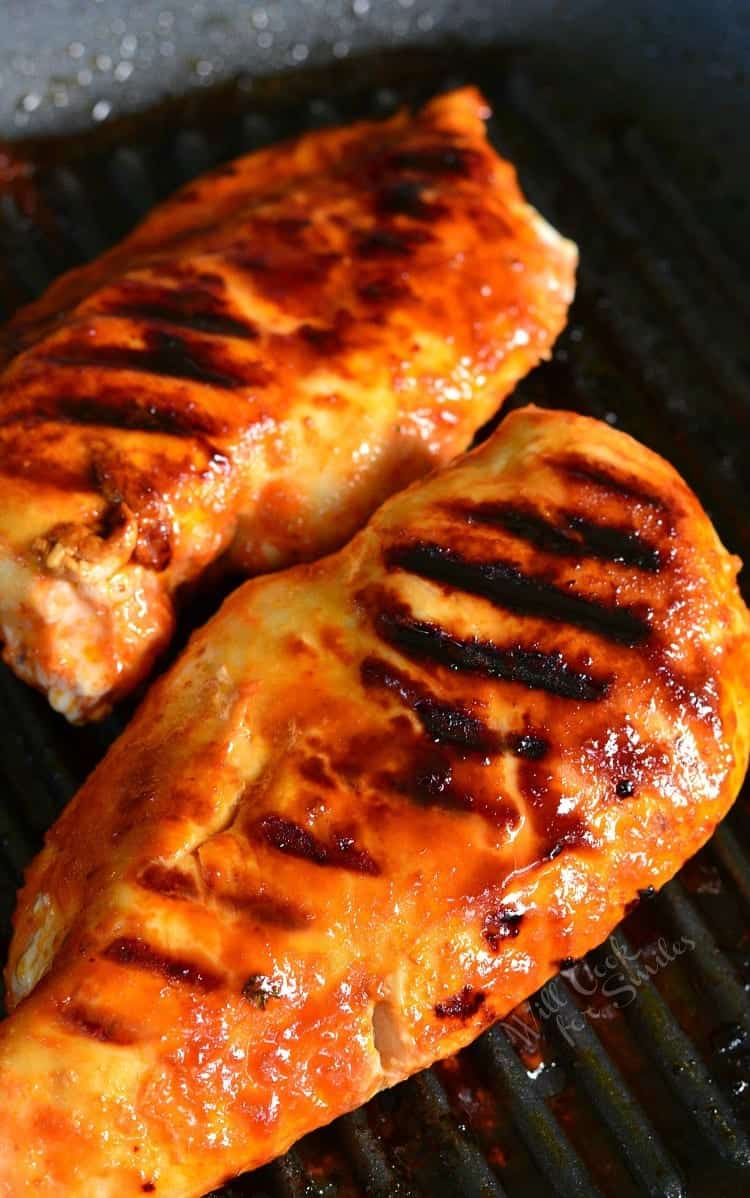 Two pieces of grilled chicken.