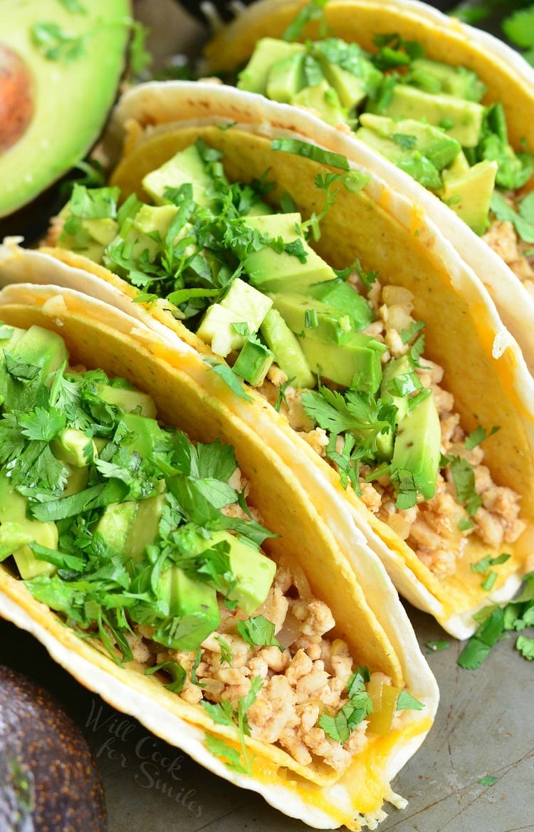 top view of Avocado Turkey Tacos in a hard shell with ground turkey, avocado and cilantro 