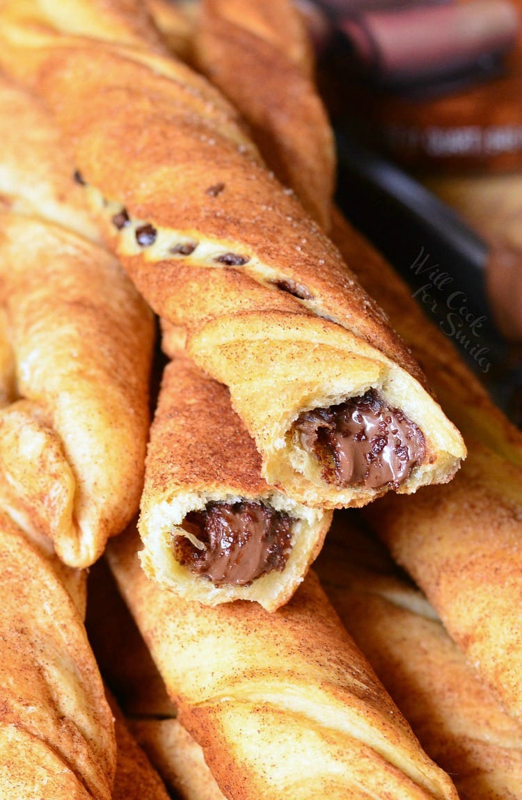 Chocolate Hazelnut Cinnamon Twists stacked up with one broke in half 