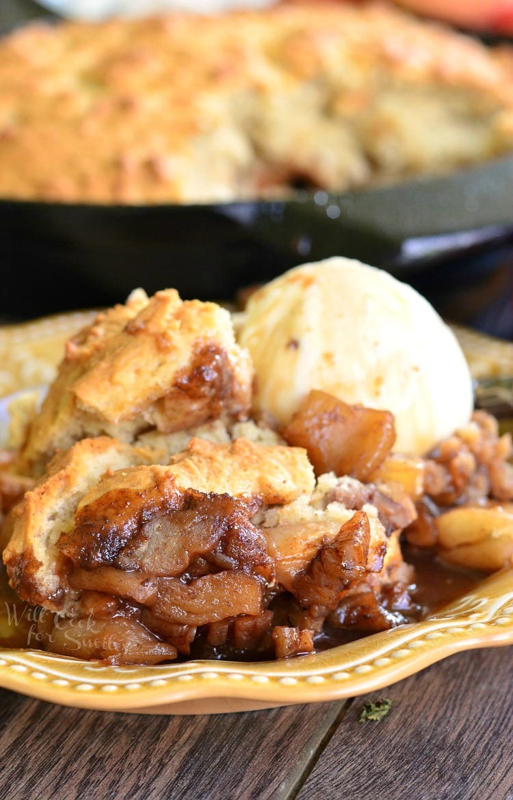 Maple Pecan Apple Cobbler with ice cream on a yellow plate 