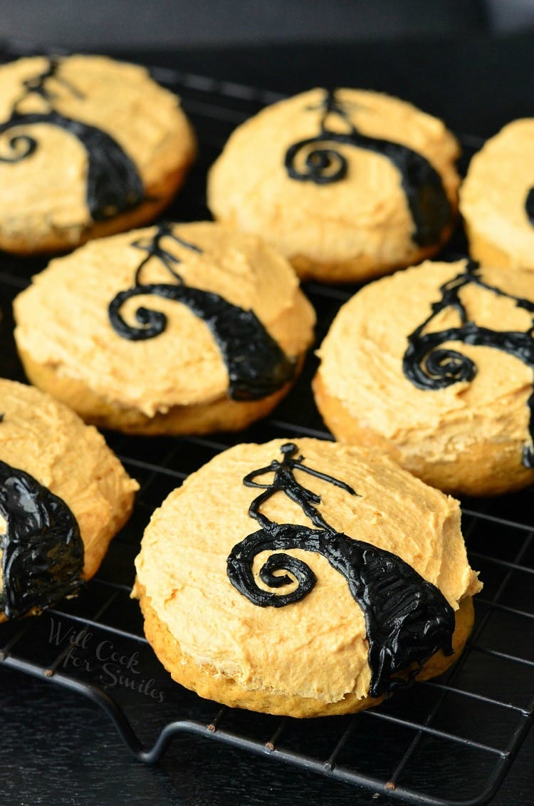 The Nightmare Before Christmas Cookies. Orange frosted cookies some with Jack on a cooling rack 