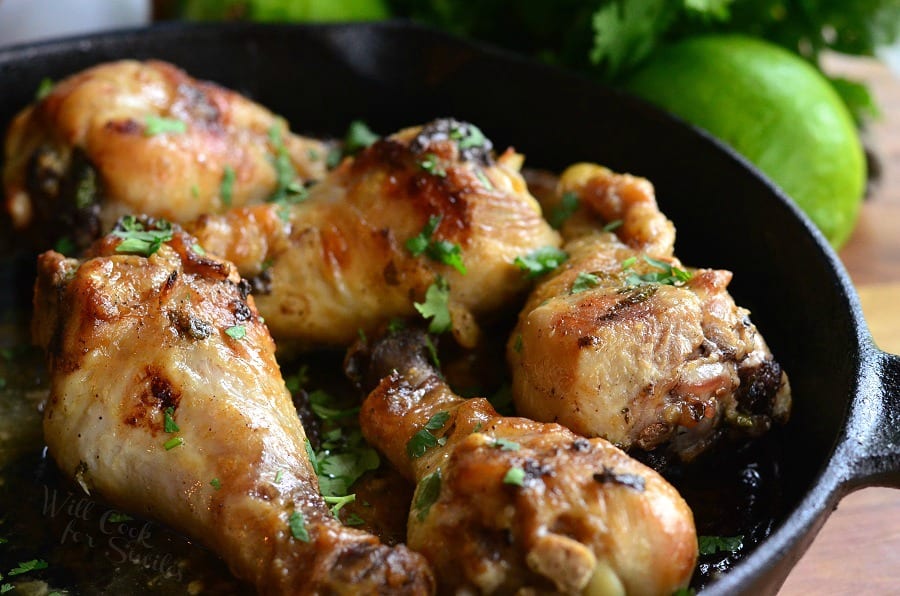 Coconut Lime Chicken Drumsticks in a cast iron pan 