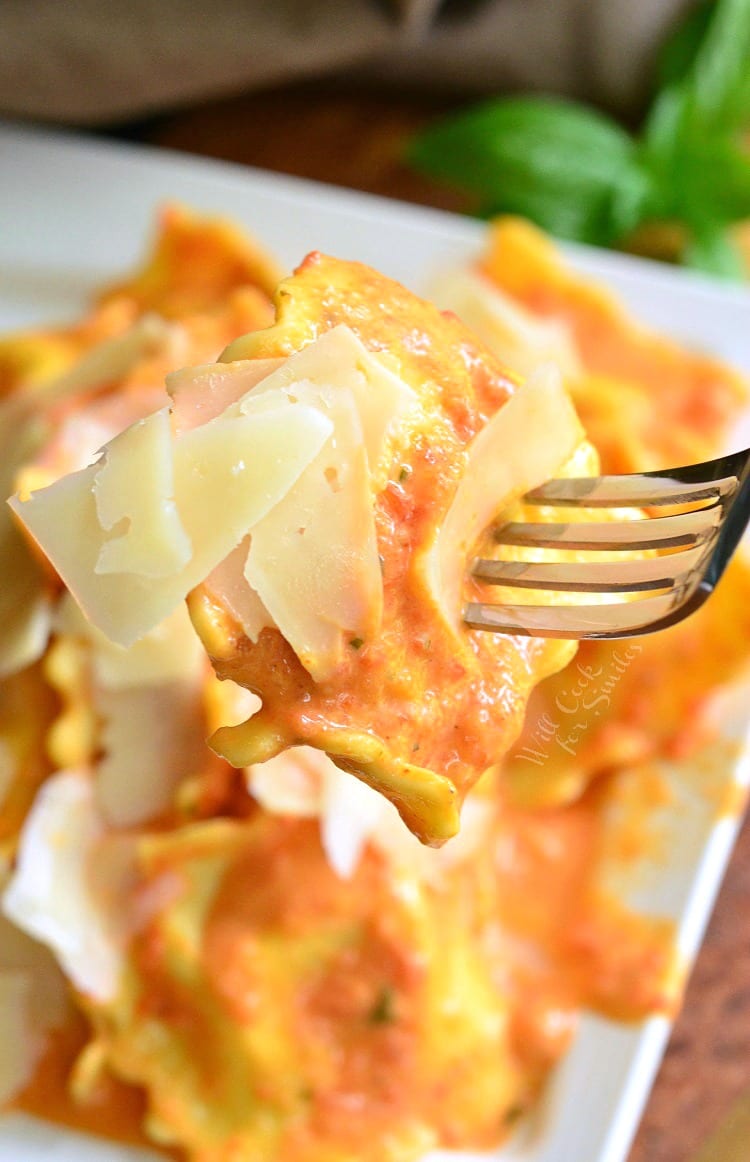 Ravioli being lifted off plate with a fork 