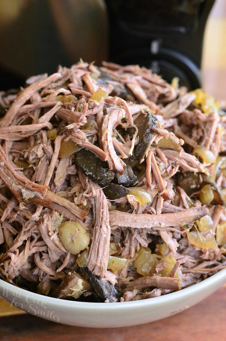 Slow Cooker Mushroom and Onion Italian Beef in a white bowl 