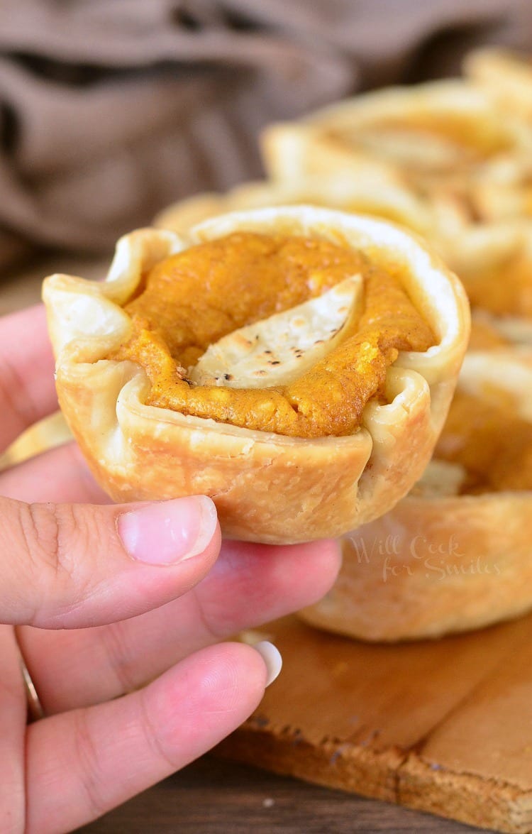 holding the mini Pumpkin Cheesecake Pie