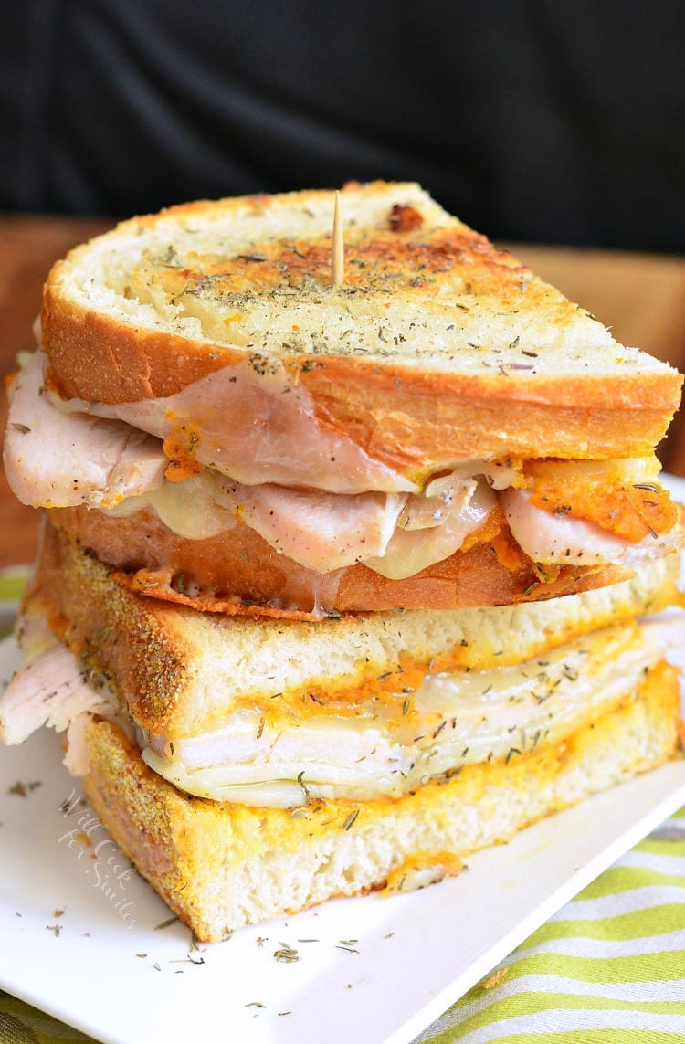 Pumpkin Turkey and Herb Grilled Cheese on a white plate 