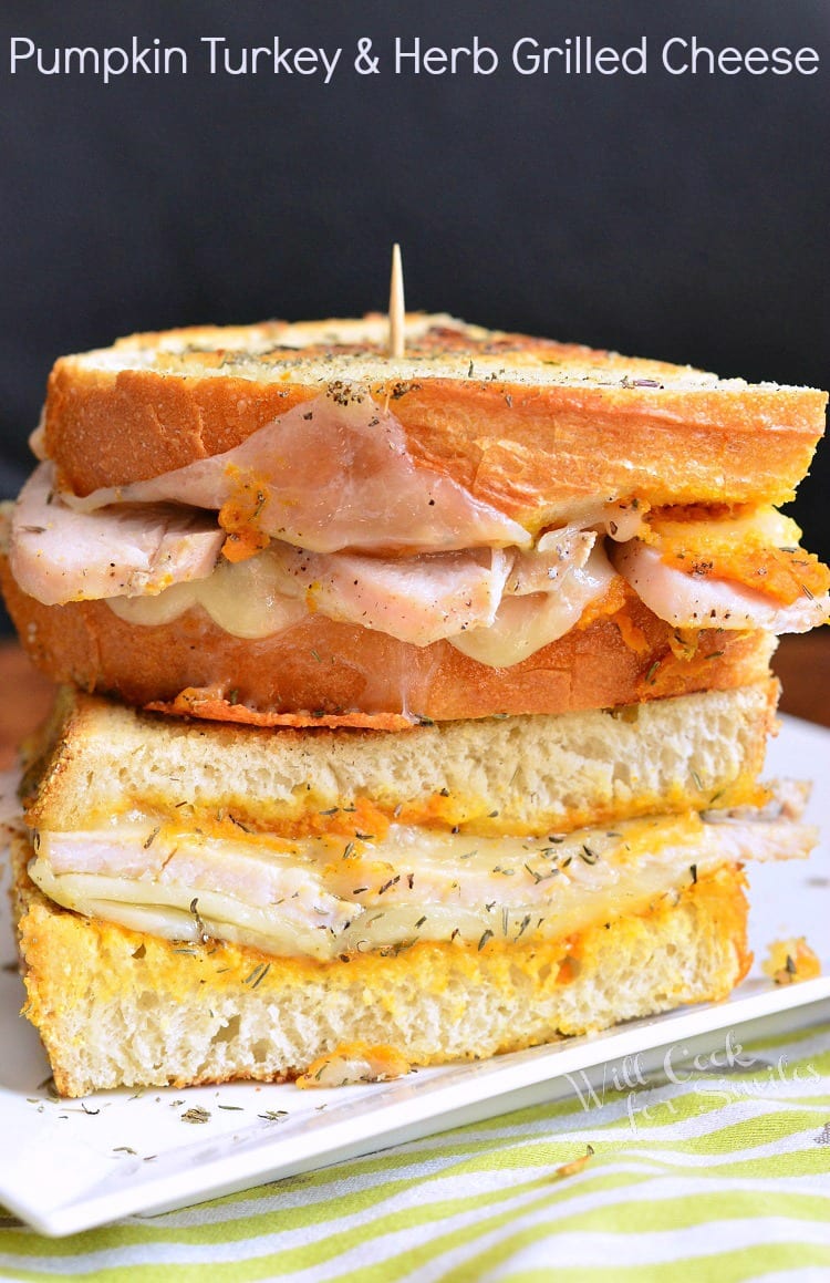 Pumpkin Turkey Grilled Cheese on a plate with a yellow and white table cloth on the table