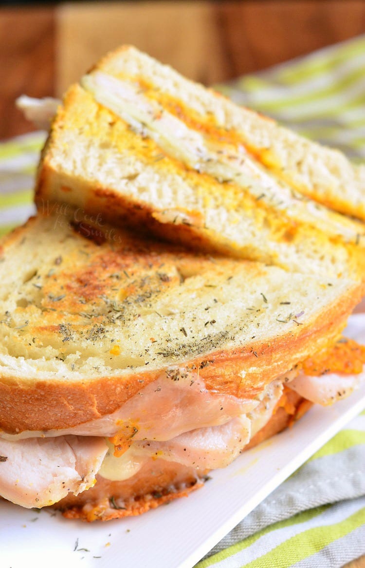 Pumpkin Turkey and Herb Grilled Cheese on a white plate 