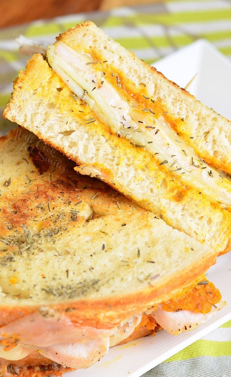 Pumpkin Turkey and Herb Grilled Cheese on a white plate 