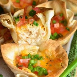 Chicken enchilada cups with stacked on top of each other with one cut in half
