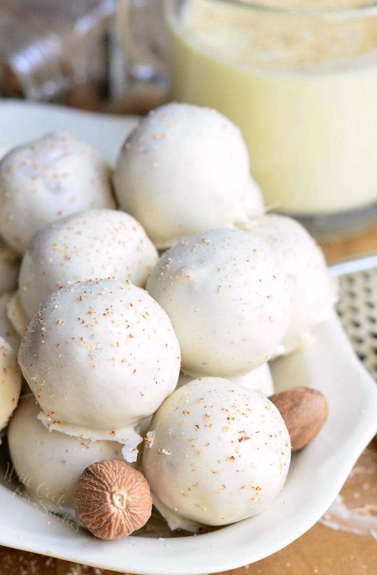 Eggnog Cookie Balls stacked in a white bowl 
