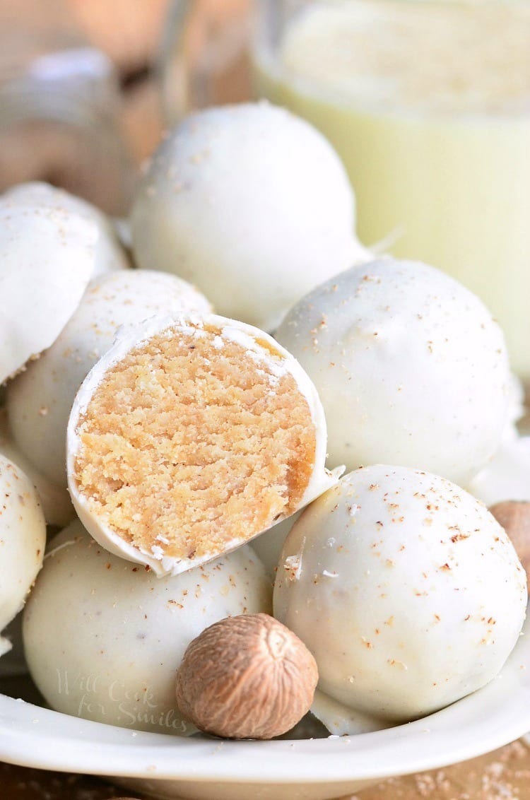 Eggnog Cookie Balls stacked in a white bowl 