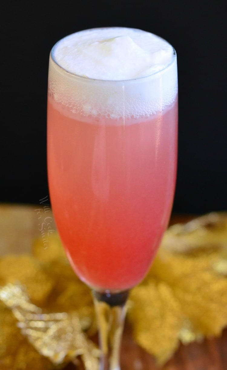 Close up of Raspberry Italian Soda Champagne Cocktail in a champagne flute 