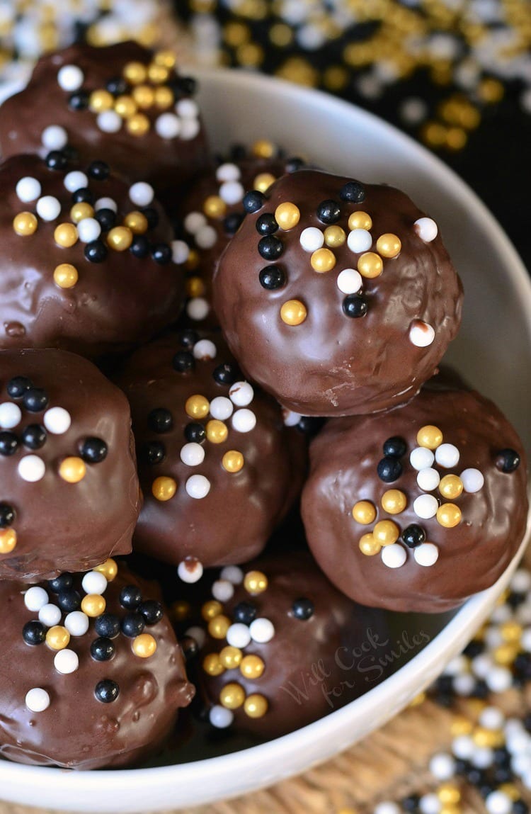 Top view of Nutella Stuffed Brownie Bites stacked up in a white bowl 