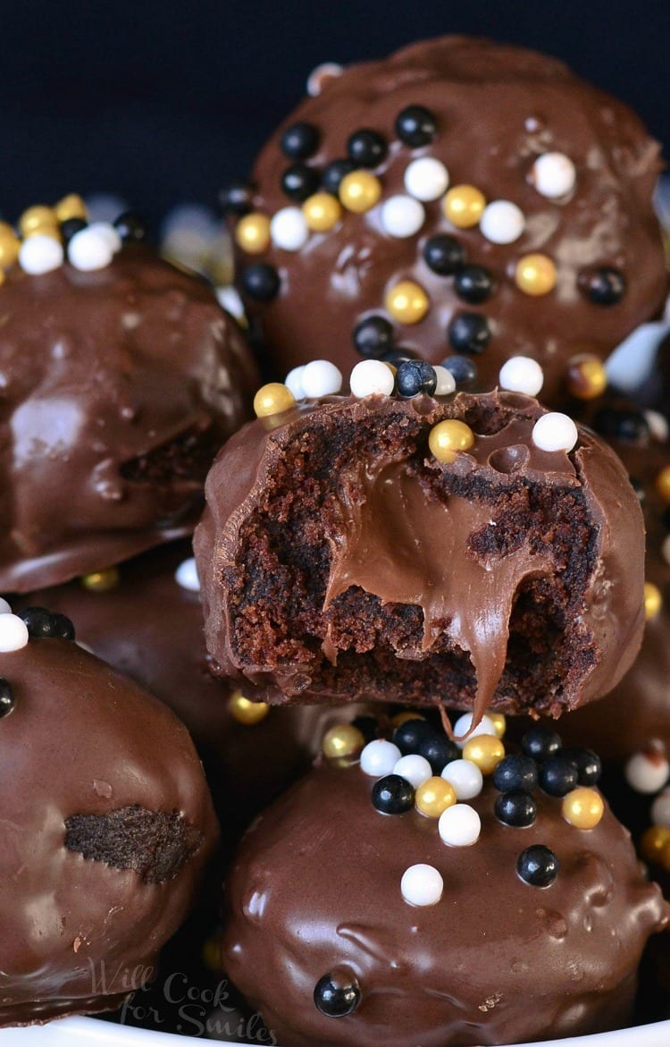 Nutella Stuffed Brownie Bites stacked up with one cut in half to show the fudgy inside 