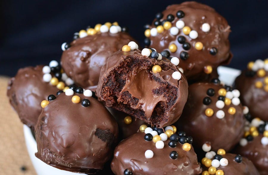 Nutella Stuffed Brownie Bites stacked up with one cut in half to show the fudgy inside 