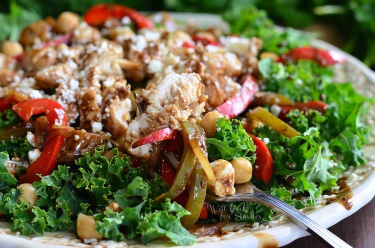 horizonal kale salad topped with chicken and veggies that have been sauteed in balsamic on a white plate with a fork dressing, chick peas on a plate with a fork 