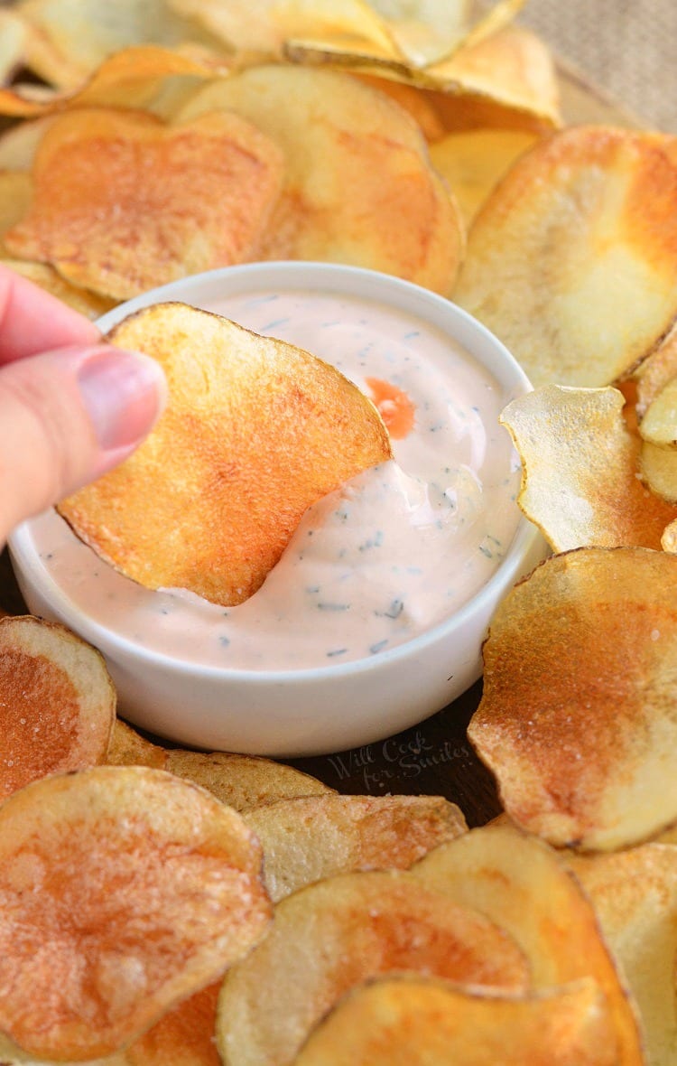 Homemade Potato Chips with Buffalo Ranch Dip in a white bowl 