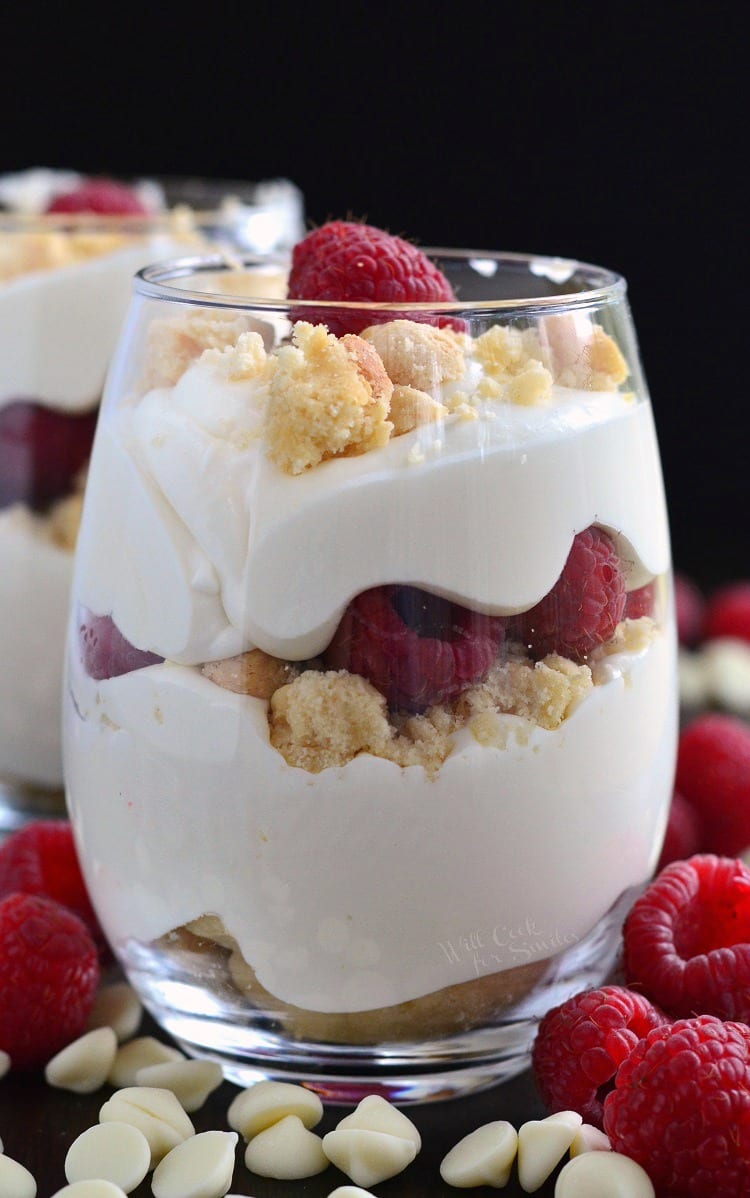 raspberry and white chocolate mousse parfait in a stemless wine glass.