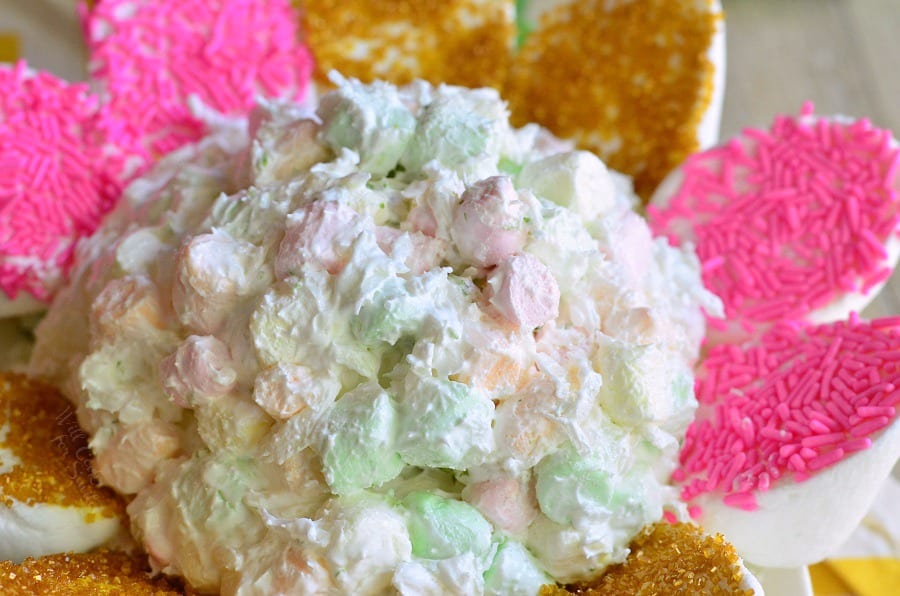 Coconut Key Lime Marshmallow Dip with pink and gold marshmallows around it 