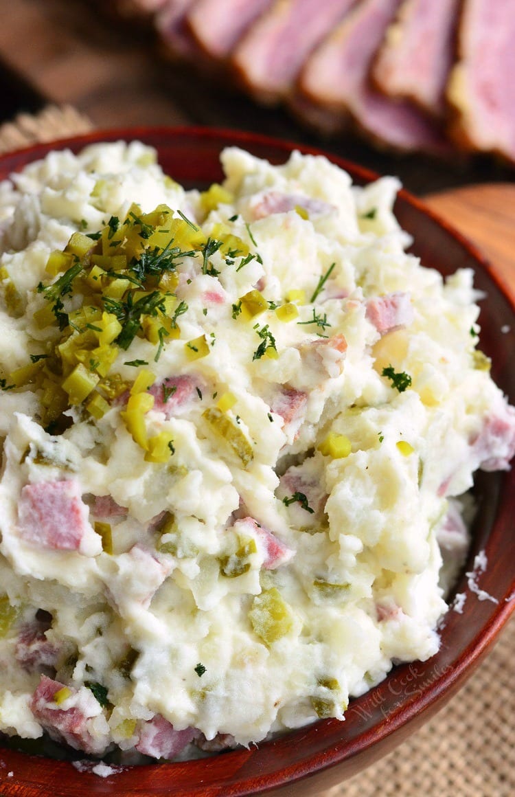 Corned Beef Potato Salad in a wood bowl with relish as a garnish 