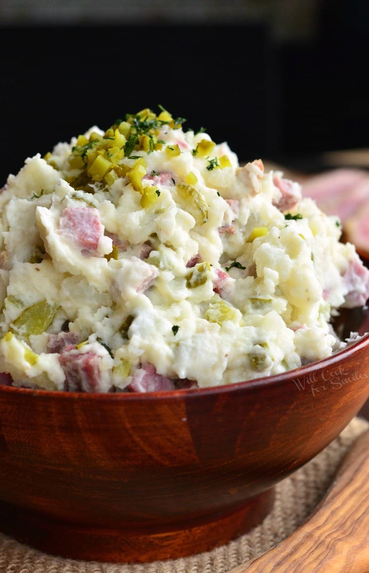 Corned Beef Potato Salad in a wood bowl with relish on top 