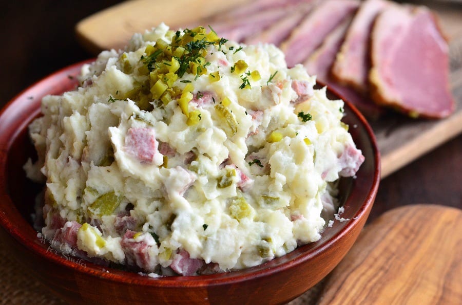 Corned Beef Potato Salad in a wood bowl with relish on top 