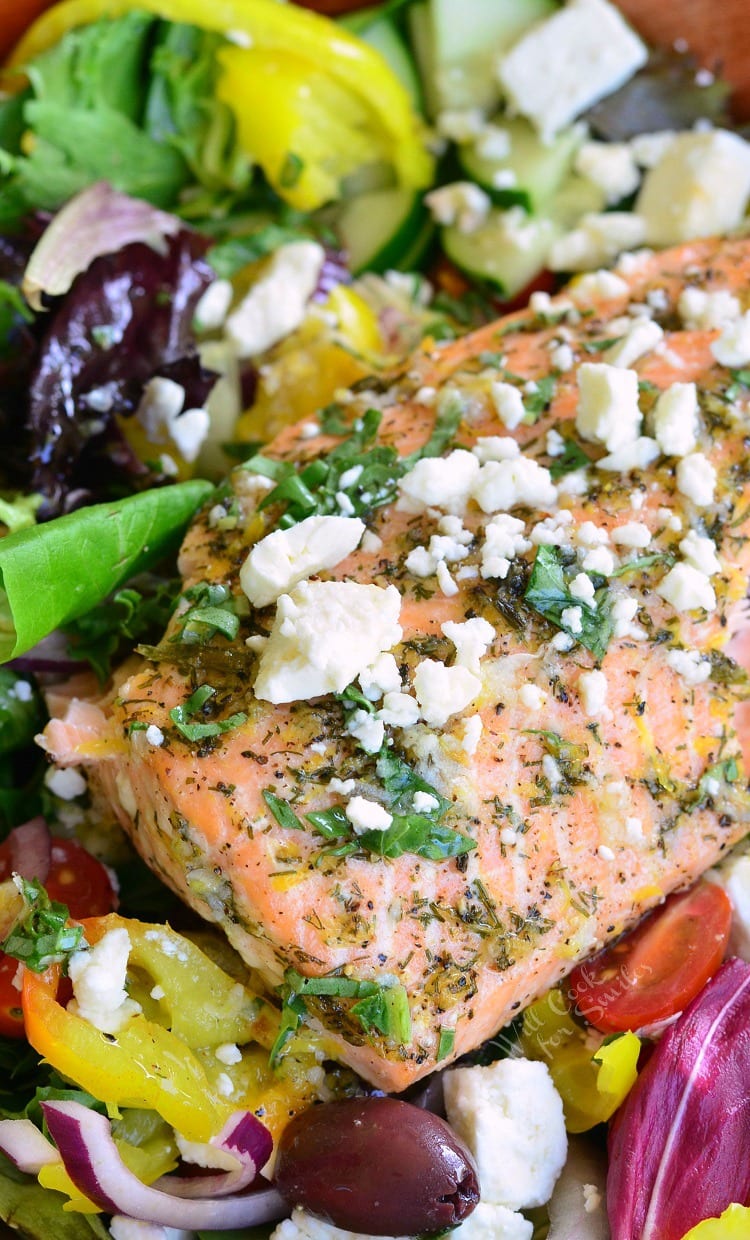 Greek Salmon Salad. This salad is made with fresh Garlic Lemon Basil Dressing and topped with succulent salmon that's been baked with lemon and herb marinade.
