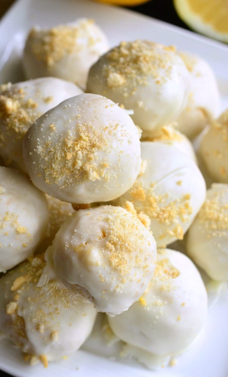 Lemon Oreo Coconut Cookie Truffles stacked up on a white plates 