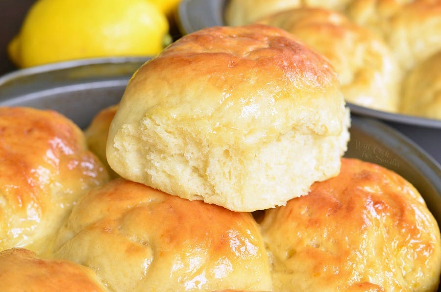 Honey Lemon Dinner Rolls stacked up in a baking pan 