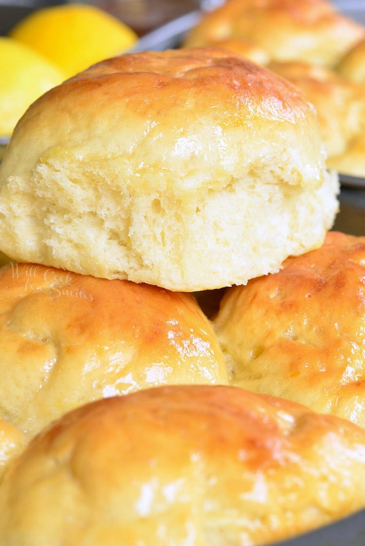 Honey Lemon Dinner Rolls stacked on a baking sheet 