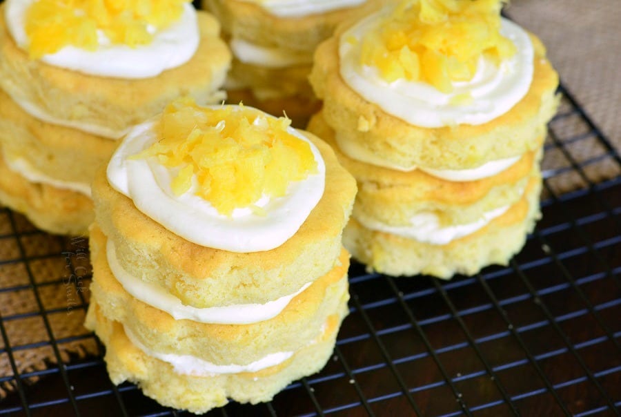 Mini Pineapple Cakes with Silky Cream Cheese Frosting on a cooling rack 