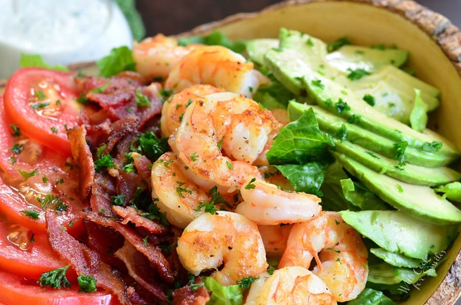tomatoes, bacon, shrimp and avocado in a bowl 