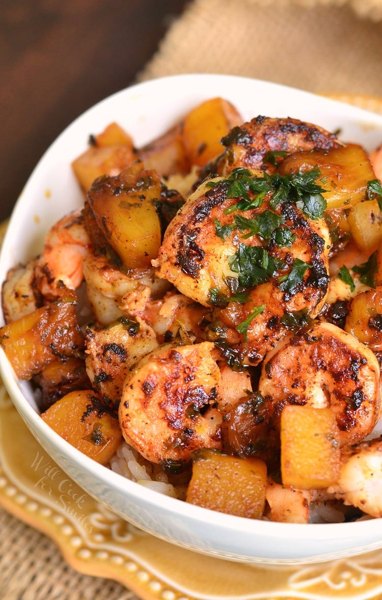 Tropical Shrimp Rice Bowl in a white bowl on a yellow plate 