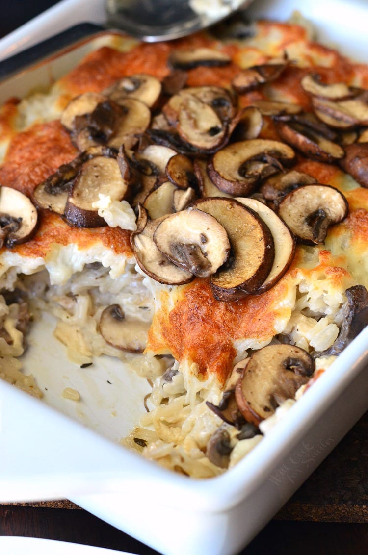 Creamy Chicken Mushroom Rice Casserole in a white baking dish 