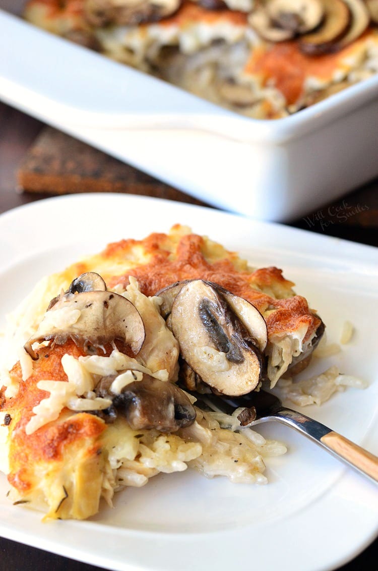 Creamy Chicken Mushroom Rice Casserole on a plate with a fork 