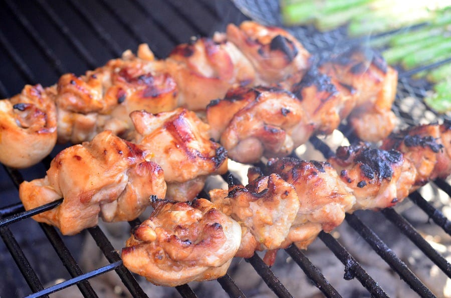 3 Chicken Thigh Kebabs on a charcoal grill 