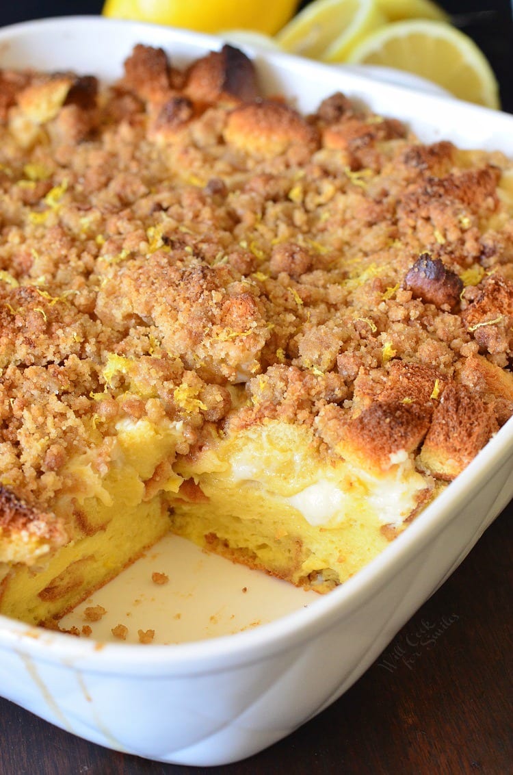 Casserole dish of French toast with a slice missing,