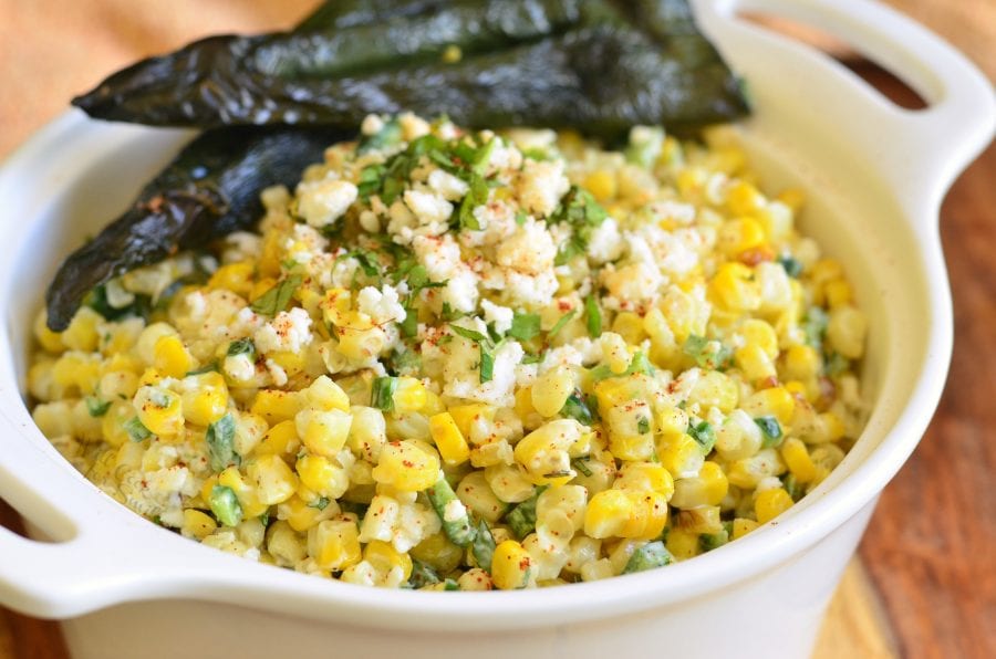 horizonal photo of mexican corn salad in a white bowl.