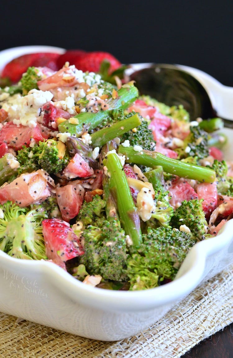 Strawberry Asparagus Broccoli Salad in a bowl with a spoon 