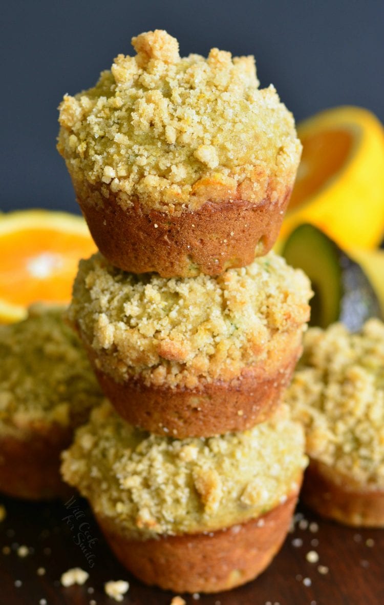 Avocado Banana Muffins with Orange Streusel stacked up in cutting board 