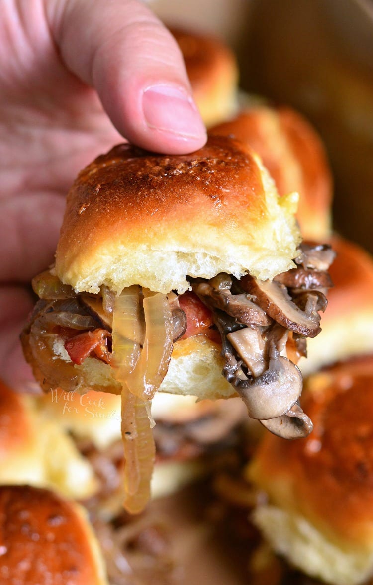 Holding a Bacon Mushroom and Onion Slider.