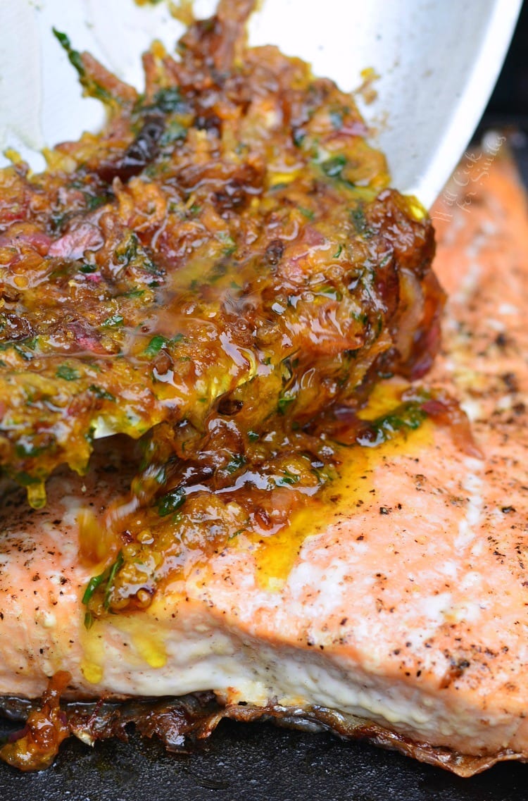 Pouring Brown Butter Citrus Sauce over salmon 