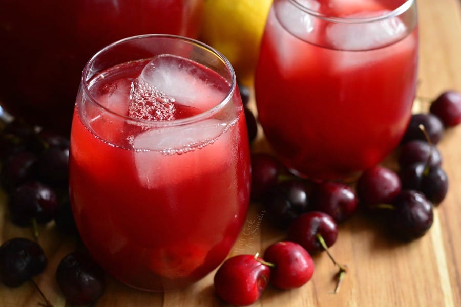 2 Stemless wine glass with Cherry Arnold Palmer on a cutting table with cherries around it